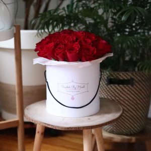 25 red roses in a medium size signaturewhite box