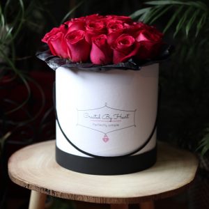 25 red roses in a medium size signaturewhite box